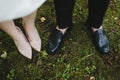 Bridal and groom wedding shoes on the background of green grass. wedding details, wedding day Royalty Free Stock Photo