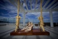 Bridal ivory shoes over swing at beach destination wedding