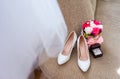 Bridal morning details composition. Top view of wedding rings, beautiful bouquet of pink flowers and leather shoes. Royalty Free Stock Photo