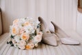 Bridal morning details composition. Top view of wedding rings, beautiful bouquet of pink flowers with ribbons, boutonniere and Royalty Free Stock Photo