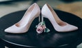 Bridal morning details composition. Wedding bouquet of pink flowers, boutonniere and leather shoes Royalty Free Stock Photo
