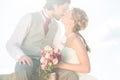 Bridal pair kissing after wedding Royalty Free Stock Photo