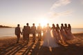 Scenic Sunset: Bridal Party on a Tranquil Beach