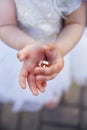 Bridal rings on baby's palm Royalty Free Stock Photo