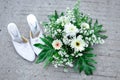 Bridal shoes and flower bouquet in the photo from above