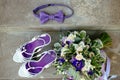 Purple wedding accessories bouquet bow tie shoes Royalty Free Stock Photo