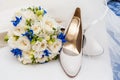 Bridal shoes, veil and wedding bouquet