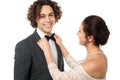 Bride adjusting her man's bow tie Royalty Free Stock Photo