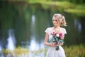 The bride admiring the sunset at the riverside.