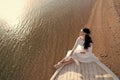 Bride adorable white wedding dress sunny day sit on boat or ship. Honeymoon sea beach. Things consider for wedding