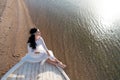 Bride adorable white wedding dress sunny day sit on boat or ship. Honeymoon sea beach. Things consider for wedding