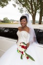 Bride african american woman in weddin day with white limousine car Royalty Free Stock Photo