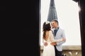 Bride backpose while hugging a fiance on the balcony of Gothic c Royalty Free Stock Photo