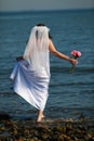Bride barefoot in water Royalty Free Stock Photo