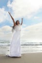 Bride on the Beach Expressing Her Joy