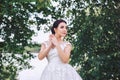 Bride in a beautiful dress posing on the river bank Royalty Free Stock Photo