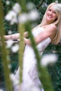 Bride behind flowers