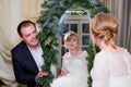 Bride and big fat groom in a nice room