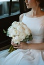 bride with a black car Royalty Free Stock Photo