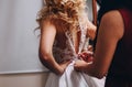 Bride blonde beautiful dress woman helps back Royalty Free Stock Photo