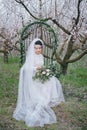 Bride in the blossoming garden