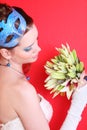 Bride with blue makeup and mask in hairdo Royalty Free Stock Photo