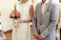 Bride with bouquet and groom at wedding registry. stylish couple Royalty Free Stock Photo