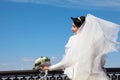 Bride with bouquet at parapet Royalty Free Stock Photo