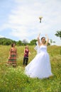 Bride bouquet toss to bachlorettes
