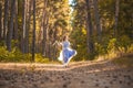 Bride with a bouquet is walking the green park Royalty Free Stock Photo