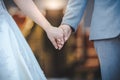 Bride and bridegroom married hands when sun is falling. Royalty Free Stock Photo