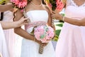 Bride and bridemaids are holding bouquets of flowers in hands on a wedding day Royalty Free Stock Photo