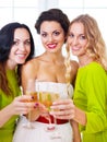 Bride and bridemaids holding wedding glass with champagne