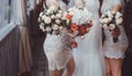 Bride and bridesmaids holding bouquets