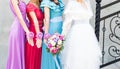 Bride with bridesmaids outdoors on the wedding day Royalty Free Stock Photo