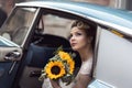 Bride in a car Royalty Free Stock Photo