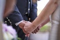 Bride and charro groom getting married holding hands