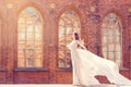 Bride on Church Background, Elegant Fashion Model in Long White Gown Beauty Portrait, Dress Waving on Wind