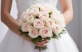 Bride with classic wedding bouquet of white and light pink flowers