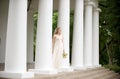 Bride on a columned porch