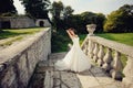 Bride between the columnes of the castle Royalty Free Stock Photo
