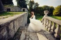 Bride between the columnes of the castle Royalty Free Stock Photo