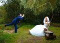 Bride cought a groom for her with a fishing rod, Royalty Free Stock Photo