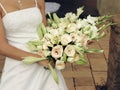 Bride with cream roses and lilies