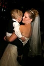 Bride dancing with son Royalty Free Stock Photo