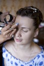 Bride doing make up