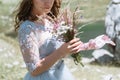 Bride in a dress walking along the road against the background o Royalty Free Stock Photo