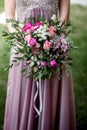 Bride in a dress with a wedding bouquet Royalty Free Stock Photo