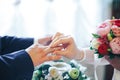 Putting On a Wedding Ring Royalty Free Stock Photo