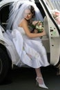 Bride exiting wedding car limo Royalty Free Stock Photo